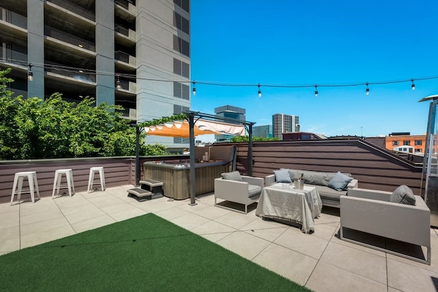 view of patio with a hot tub, an outdoor living space, and outdoor dry bar
