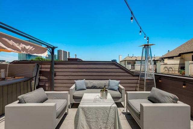 view of patio featuring an outdoor hangout area, a pergola, and a balcony
