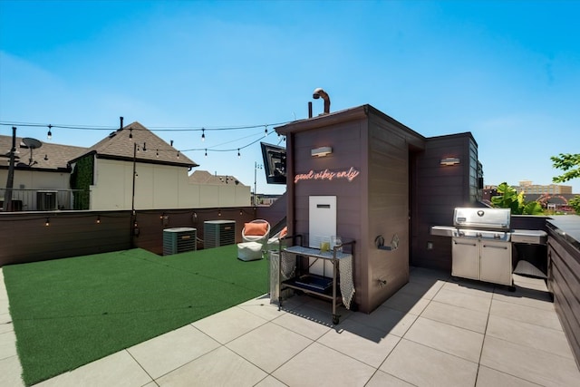 view of outdoor structure with fence and cooling unit