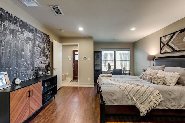 bedroom featuring recessed lighting, dark wood-style floors, and visible vents