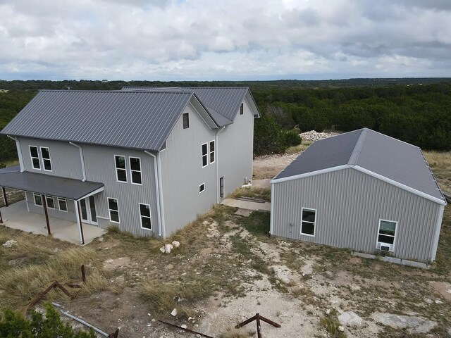 aerial view featuring a view of trees