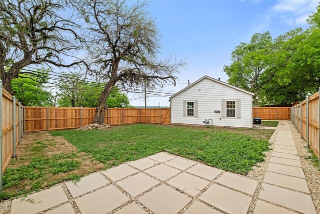 view of yard featuring a fenced backyard and a patio area