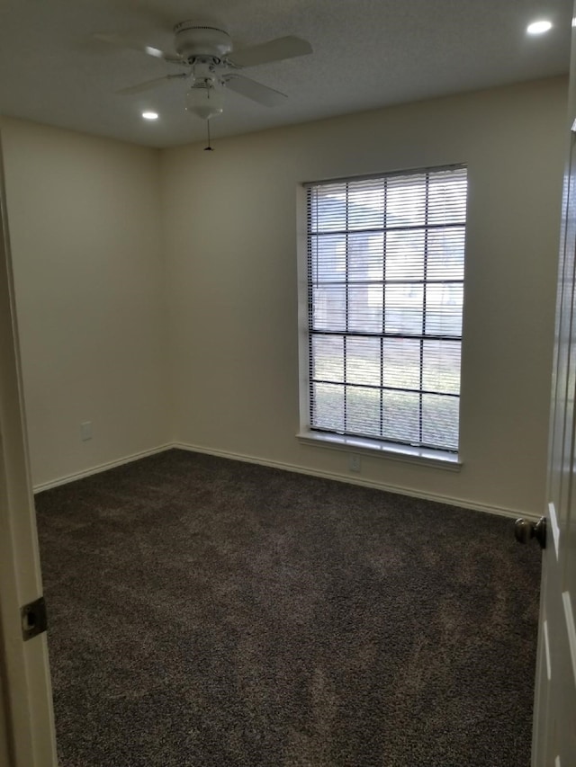 unfurnished room featuring dark colored carpet, recessed lighting, baseboards, and ceiling fan
