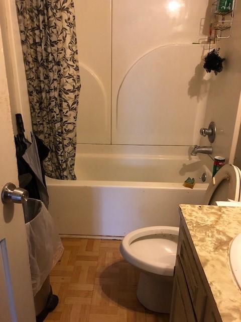2908 Hardy St, Shreveport, LA 71109 - full bath with vanity, toilet, and shower / bath combination with curtain