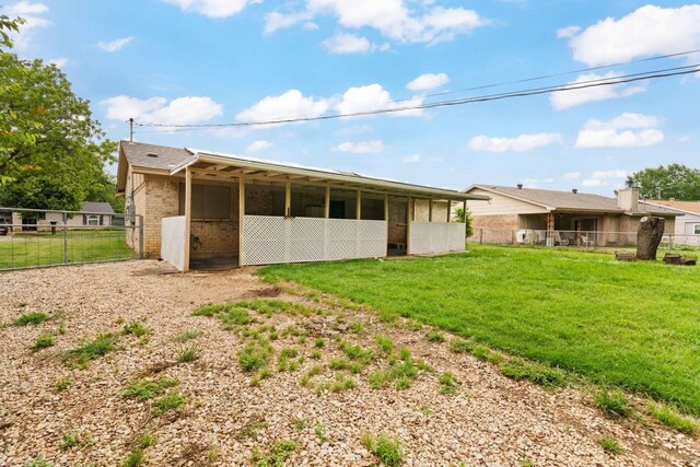 back of property featuring brick siding, an exterior structure, and an outbuilding