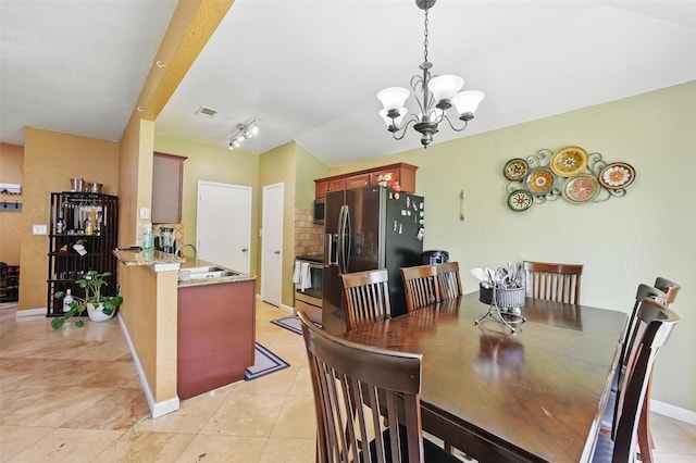 3145 Ronay Dr, Forest Hill, TX 76140 - dining room featuring a notable chandelier, visible vents, baseboards, light tile patterned flooring, and lofted ceiling