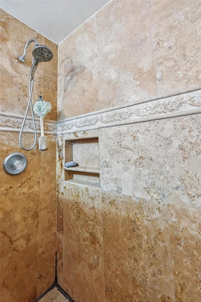3145 Ronay Dr, Forest Hill, TX 76140 - room details featuring a textured ceiling and tiled shower