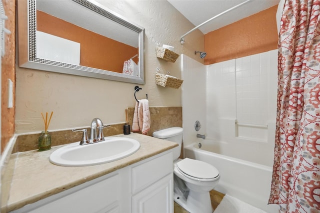 3145 Ronay Dr, Forest Hill, TX 76140 - bathroom featuring vanity, toilet, a textured wall, and shower / bathtub combination with curtain