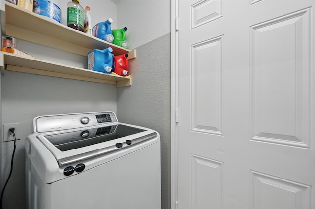 3145 Ronay Dr, Forest Hill, TX 76140 - washroom with washer / dryer, laundry area, and a textured wall