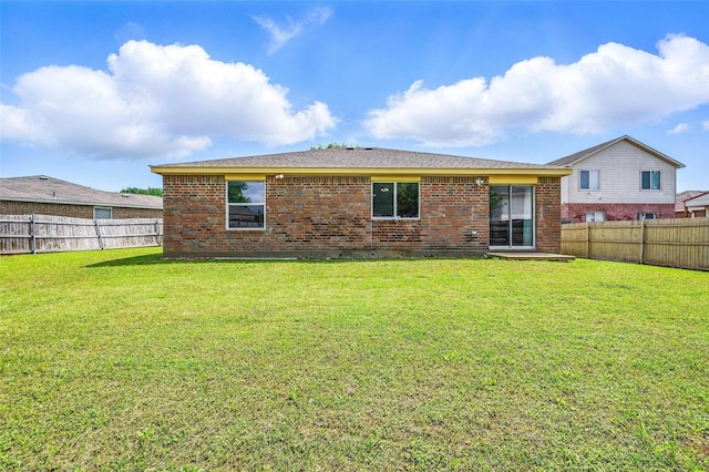 3145 Ronay Dr, Forest Hill, TX 76140 - rear view of house with a lawn, brick siding, and a fenced backyard