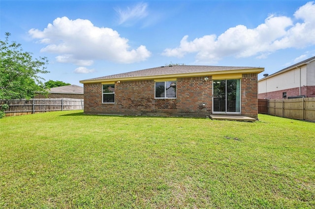 3145 Ronay Dr, Forest Hill, TX 76140 - rear view of property with a lawn, brick siding, and a fenced backyard