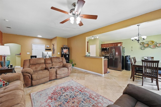 3145 Ronay Dr, Forest Hill, TX 76140 - living area featuring light tile patterned floors, visible vents, baseboards, and ceiling fan with notable chandelier