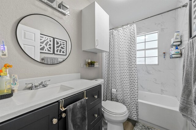 bathroom with vanity, shower / bath combination with curtain, and toilet