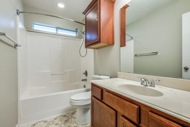 bathroom with vanity, toilet, a textured ceiling, and tub / shower combination