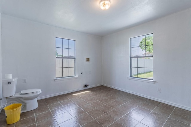 tiled empty room with baseboards