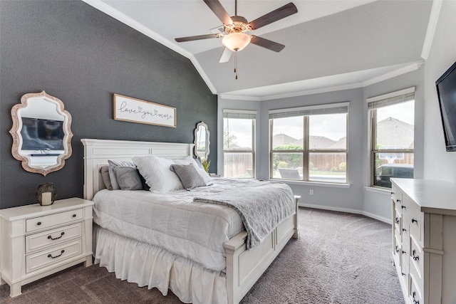 carpeted bedroom with crown molding, baseboards, a ceiling fan, and lofted ceiling