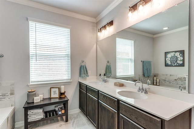full bathroom featuring a sink, baseboards, crown molding, and a tub