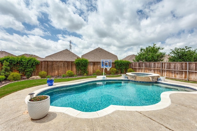 view of swimming pool with a pool with connected hot tub and a fenced backyard