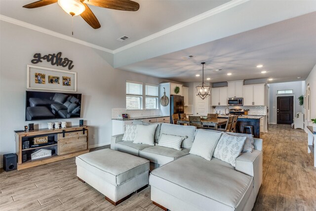 148 Mossy Oak Trl, Fort Worth, TX 76131 - living area with recessed lighting, light wood-style floors, crown molding, and a ceiling fan
