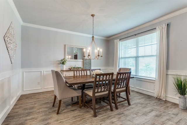 148 Mossy Oak Trl, Fort Worth, TX 76131 - dining area with a chandelier, a decorative wall, ornamental molding, a wainscoted wall, and wood finished floors