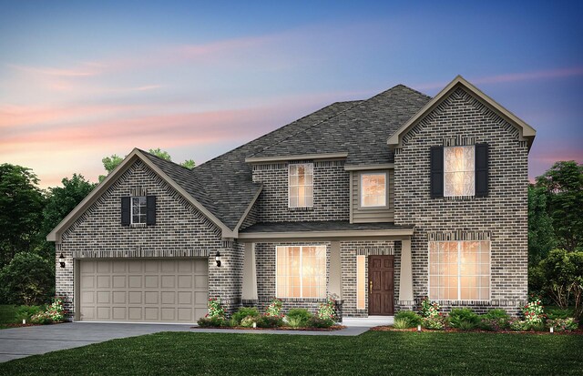 2713 Creekdale Dr, Celina, TX 75009 - view of front of house featuring a yard, a shingled roof, concrete driveway, and brick siding