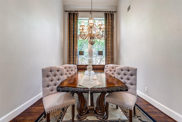 dining space featuring baseboards, visible vents, a wealth of natural light, and wood finished floors