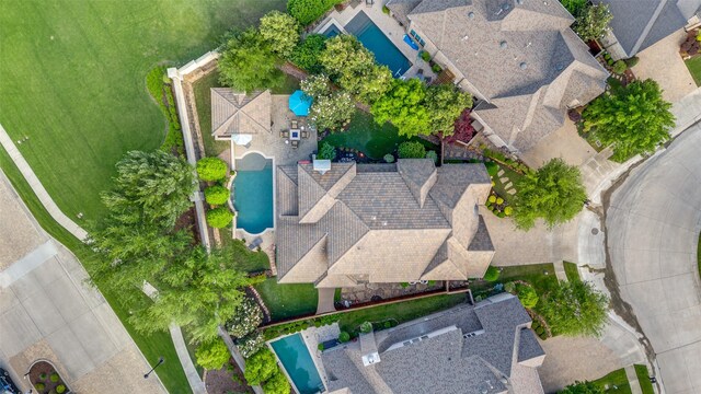 birds eye view of property featuring a water view and a residential view