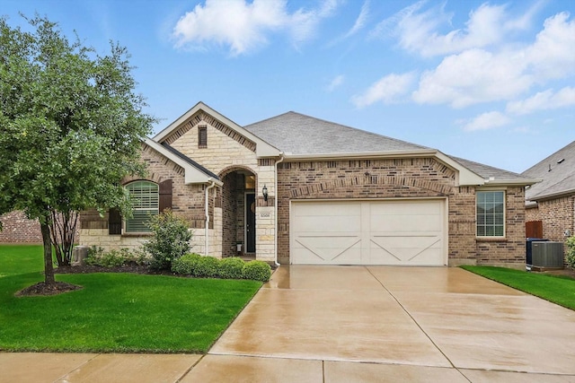 french provincial home with roof with shingles, a front lawn, brick siding, a garage, and driveway