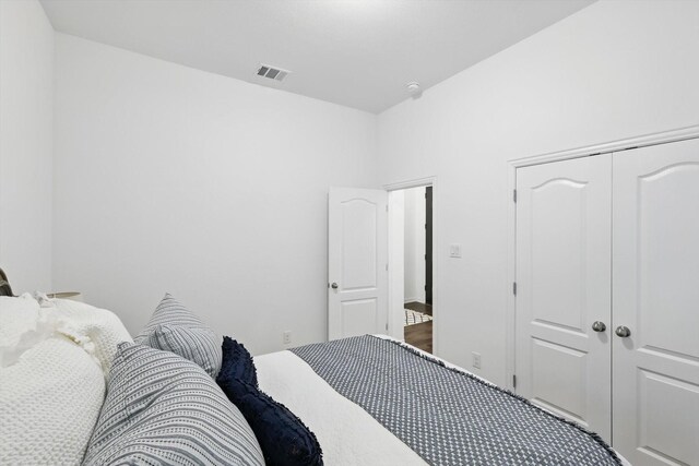 bedroom featuring a closet and visible vents
