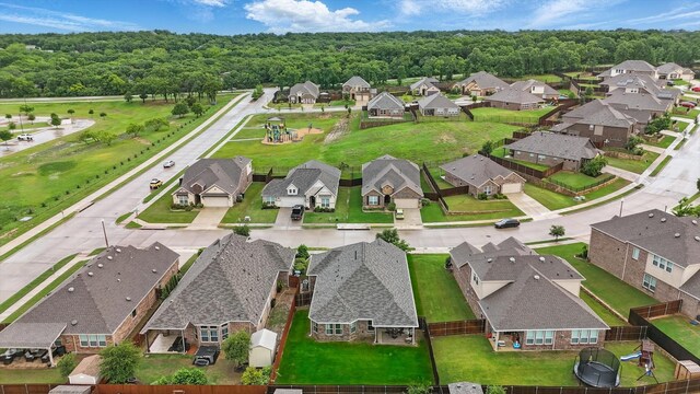 drone / aerial view with a residential view and a forest view