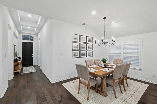 dining area with a chandelier, baseboards, visible vents, and dark wood finished floors