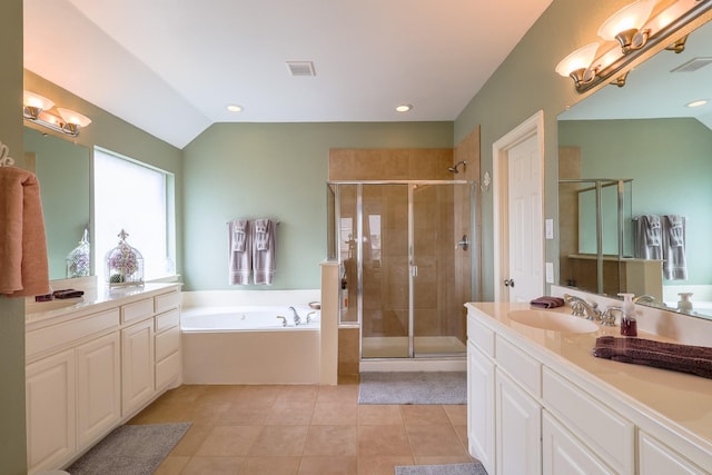 8201 Mckenzie Ct, Frisco, TX 75036 - bathroom with vanity, a stall shower, a bath, tile patterned floors, and vaulted ceiling