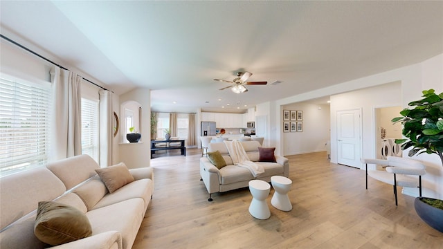 living room with a ceiling fan, visible vents, recessed lighting, and light wood-style floors