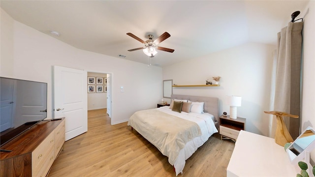 bedroom with visible vents, light wood finished floors, ceiling fan, and baseboards