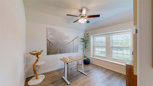 home office featuring baseboards, a ceiling fan, and wood finished floors