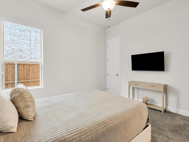 bedroom featuring carpet floors, baseboards, and ceiling fan