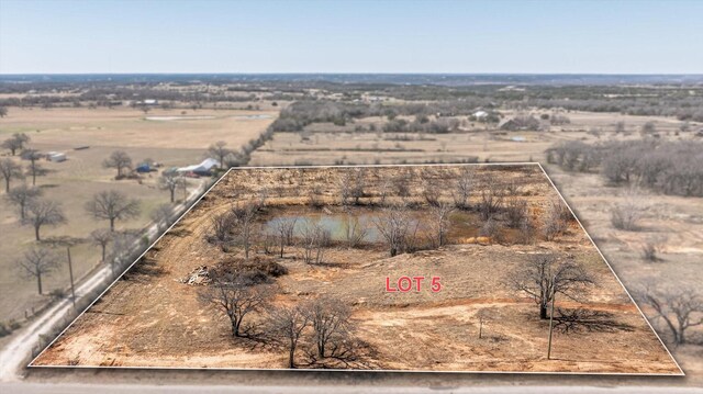 birds eye view of property featuring a rural view