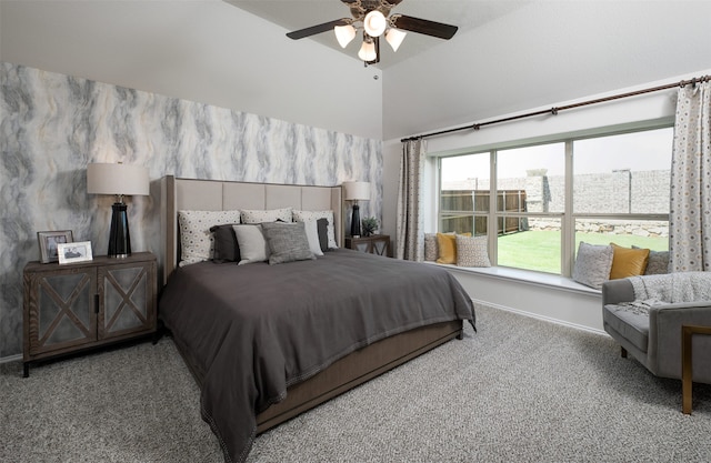 carpeted bedroom with high vaulted ceiling, ceiling fan, and baseboards