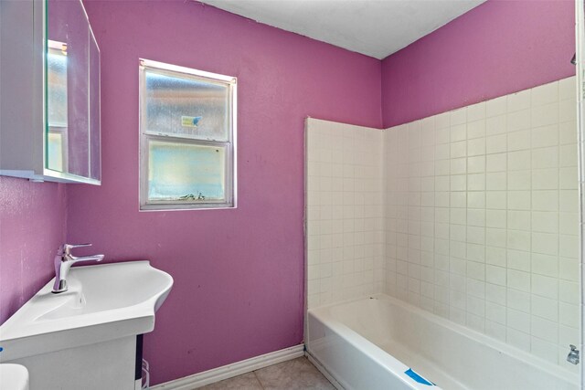 bathroom with baseboards and tile patterned floors