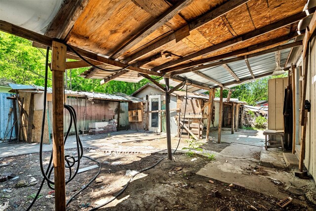 view of patio / terrace featuring an outbuilding