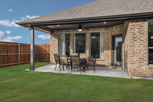 view of patio / terrace with fence and ceiling fan