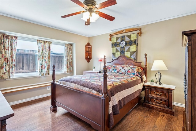 bedroom with crown molding, baseboards, ceiling fan, and wood finished floors