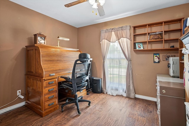 home office with baseboards, ceiling fan, and wood finished floors