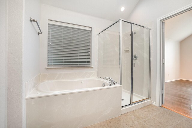 bathroom with tile patterned flooring, a stall shower, recessed lighting, and a bath