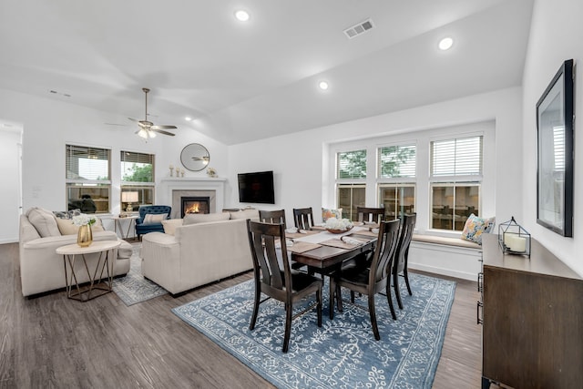 dining space with ceiling fan, visible vents, plenty of natural light, and vaulted ceiling