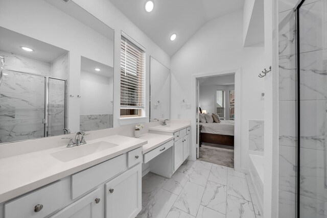 bathroom with vanity, marble finish floor, lofted ceiling, connected bathroom, and a marble finish shower