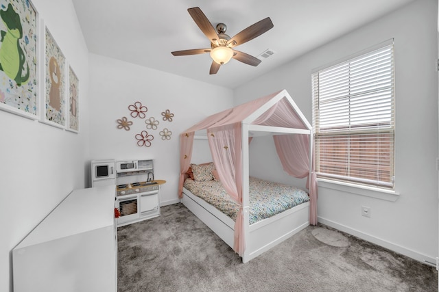 bedroom with baseboards, light carpet, a ceiling fan, and visible vents