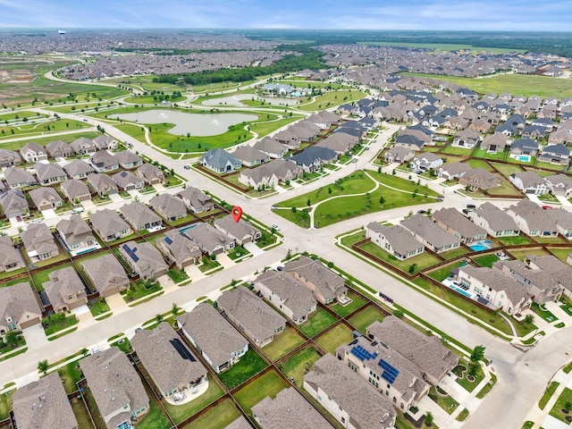 birds eye view of property featuring a residential view and a water view