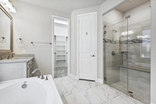 full bath featuring vanity, a garden tub, marble finish floor, and a stall shower
