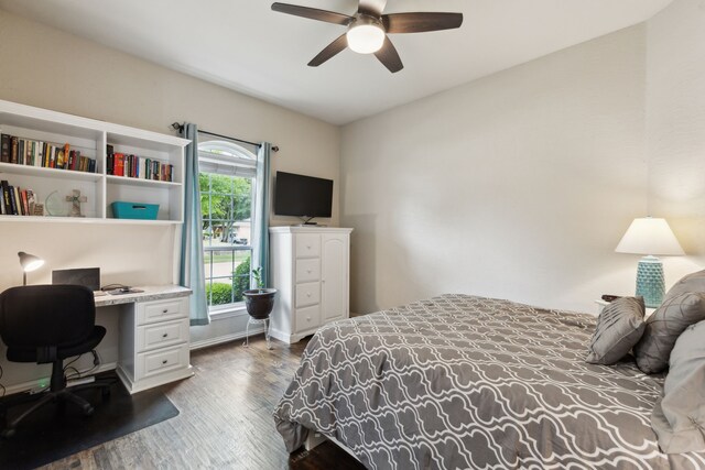 401 Willow Run, Prosper, TX 75078 - bedroom with a barn door, dark wood-style flooring, multiple windows, and ensuite bathroom